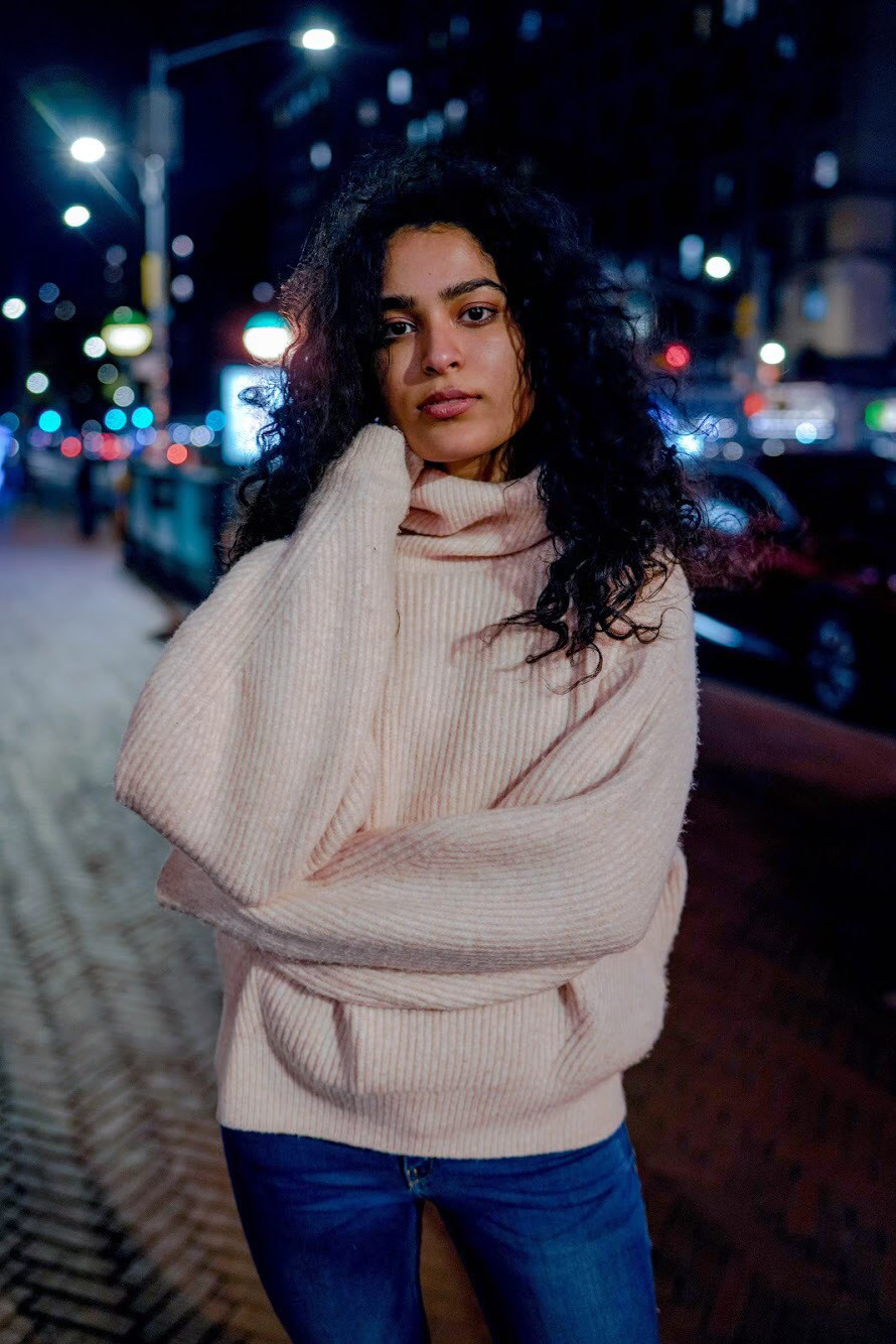 A image of a concrete sphere, balanced between two other larger spheres